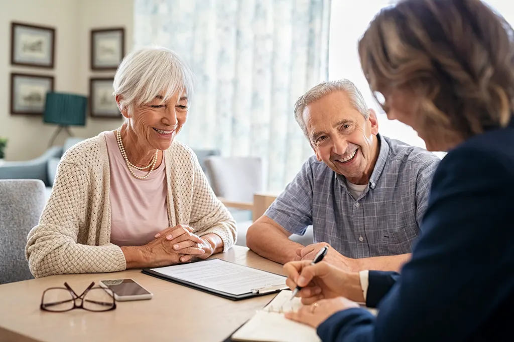 Elderly couple filling out forms